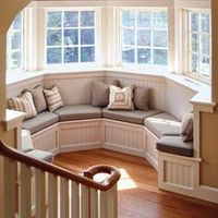 How to turn an awkward bay window without right angles into a comfy, welcoming space using stock cabinets. | Photo: Eric Roth | thisoldhouse.com