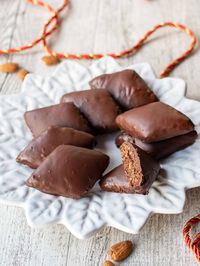 Mustaccioli Cookies are going to be your favorite festive recipe! It’s got everything you want in a Christmas cookie - warming spices, chocolate, and fragrant orange. #MustaccioliCookies #MostaccioliCookies #ChristmasCookies