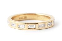 About 15¬†elegant white baguette cut diamonds are¬†flush set into an 18 karat gold band. Recycled 18 Karat Gold 15 Polished White Baguette diamonds, 3x1.5mm each Made to order ring, please allow 4-6 weeks for production