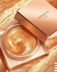 PATRICK TA Major Glow All-Over Glow Balm: A universal, moisturizing face and body gloss that creates a decadent, glass-like glow.