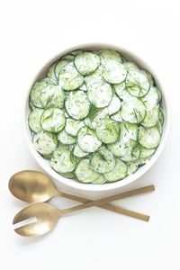 This refreshing Cucumber Yogurt Salad recipe features all the flavors of tzatziki in salad form. So if you love tzatziki, then you will love this creamy cucumber salad with all it's Greek and Mediterranean vibes. It’s loaded with crunchy cucumbers, creamy Greek yogurt, fresh dill, garlic and lemon. A quick and easy side dish that is SO GOOD! | www.mapleandmango.com