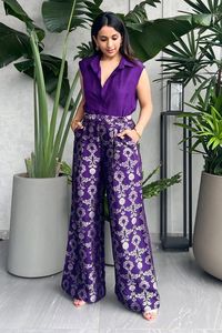 Purple shirt in silk base with spread collared neckline. Paired with floral jaal brocade woven pant. Components: 2 Pattern: Woven Type Of Work: Floral Neckline: Spread collar Sleeve Type: Cap sleeves Fabric: Silk Color: Purple Other Details:  Side pockets Front concealed button placket Occasion: Party - Aza Fashions