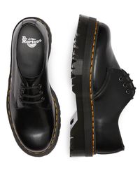 Dr Martens classic 1461 shoe has hit new heights. Built on our highest platform to date, our 1461 Quad has been given an empowering rework. The shoes are built from Polished Smooth leather and welted in place with our unmistakable yellow stitching. Polished Smooth is the original Dr. Martens leather: super durable, with a smooth finish polished to a high shine. Clean with a damp cloth and care with Dr. Martens Shoe Polish Stacked on a 1.5 inch Quad sole Our Goodyear-welted lines are heat-sealed