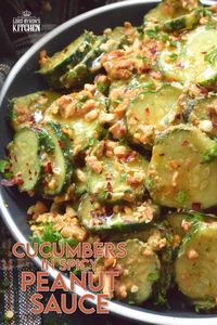 Fresh cucumbers are sliced and tossed in a quick and easy homemade nutty, salty, creamy, spicy, and garlicky sauce.  Toasting the peanuts first and combining them with peanut butter, soy sauce, and rice vinegar makes a delicious cold side, salad, or snack.  Serve at room temperature immediately after preparing for the best results! #cucumber #peanut #peanutbutter #peanutsauce #salad #spicy