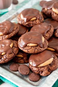 Buckeye Cookies have a boxed brownie cookie base that's covered in a peanut butter topping before being finished off with melted chocolate! Whip up over two dozen cookies in under 30 minutes!