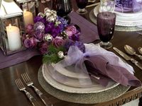 Retro-Inspired Purple and White Christmas Decorations : Amethyst linens and goblets mixed with silver and gold make for a regal and festive place setting. From DIYnetwork.com