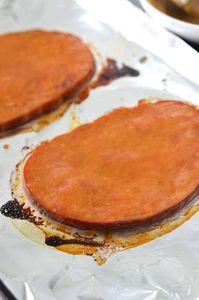 How to cook ham steak in the oven with a mustard glaze. Great for breakfast or small batch ham steaks for an easy holiday dinner.