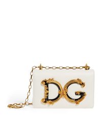 A simple silhouette defined by unmistakable metallic hardware - updated for Spring/Summer 2019 in an elaborate baroque design - this Dolce &amp, Gabbana DG Girls cross-body bag is a versatile answer to evening styling. Suspended from a ruthenium-galvanised chain strap, the classic shape is crafted from supple leather in an elegantly minimal hue.