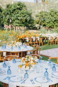 A custom jean jacket for the bride, lush pop of orange florals, a chic something blue wedding design, and dreamy views of the Mexican countryside came together perfectly for Maggie & Jeremy's I-DOs at Flora Farms in San Jose Del Cabo. We love how Amy Abbott Weddings & Events, Gideon Photography, and Pina Hernandez brought the day together.