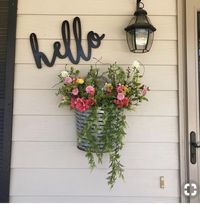 Maybe add a little hanging basket with some fake flowers... ?