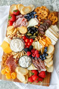 Learn how to make a Charcuterie board for a simple no-fuss party snack! A meat and cheese board with simple everyday ingredients is an easy appetizer!