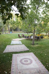 Create a boho design dream wedding aisle for your wedding ceremony using vintage are rugs and mats available to rent from Orange Trunk Vintage Rentals in Calgary, Alberta. Spread aprt or layered together, a boho wedding aisle of vintage are rugs is on our trend watch for 2021