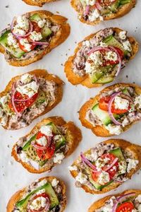 This Greek Bruschetta is a combination of a Greek Salad and Bruschetta! They're perfect to serve as an appetizer for your next party