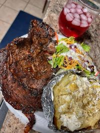 Ribeye Steak, huge baked potato and tossed salad with ranch