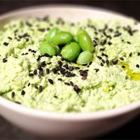 Put a spin on traditional hummus and make it with frozen edamame instead of chickpeas. Tahini, garlic, cilantro, and lemon juice add plenty of flavor too.