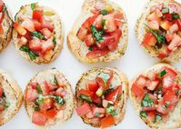 Toasted baguette slices topped with a fresh tomato and basil mixture. So delicious and easy to whip up. You'll be making this homemade bruschetta all summer long! #bruschetta #tomatoes #basil #fresh #summer #summerrecipes #appetizers #appetizerrecipes #easyappetizers #summerappetizers #recipes #iheartnaptime