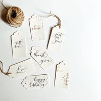 Gift tags with custom calligraphy! Elevate your gifts with custom gift tags! Each gift tag is hand-lettered in calligraphy with durable ink on high quality cardstock paper. Twine is included with each tag. These gift tags can be used as wedding place cards, message tags, mason jar tags, party favor tags, drink tags, etc.  If you don't see the color you want, please message me and I will personally work with you to match your needs. Materials:  - 300 gsm paper - Twine string  Size:  - Gift tag: 2x4in (~5x10cm) Please message me if you have any questions :) **Social Media** Follow and tag me @erinbeletterin