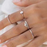 This unique ring has a sparkling oval gemstone surrounded by textured detailing in the sterling silver setting. This gemstone ring is unlike anything out there!  The gemstone measures 6mm x 5mm. Made with cubic zirconia.