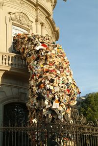 a sculpture of 5000 books pouring out of a house in spain