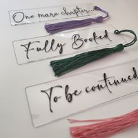 Gorgeous acrylic bookmarks, with fun phrases to choose from - perfect for book lovers, so why not treat a loved one? (or better still, yourself!)  Bookmark is acrylic, with black vinyl lettering.  We also offer a range of coloured tassels, take your pick! Bookmark measures approx. 12cm x 3cm Can't find what you're looking for - please message me with your idea, and I will do everything to make your visions come to life!