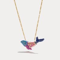 Whale Necklace from Selenichast belongs to marine life series, which includes different enamel jewelry inspired by marine organism. All of them are made from 18k gold and enamel plates.