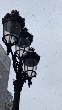 Snow falling on lamp posts in Paris #LampPost #ParisLampPost #FrenchLampPost #StreetLights #StreetLight #SnowInParis #ParisSnow #WinterInParis #ParisWinter #FrenchArchitecture #ParisArchitecture #JanuaryInParis #ParisJanuary