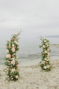 A broken arch in green, peach and nude colors