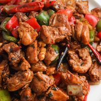 Kung Pao Chicken. Tender chicken stir fried in a savoury, sweet, spicy kung pao sauce with bell peppers, onions, peanuts and dried chilies. An aromatic and popular Chinese dish that has been a classic for good reason! Great as a main dish and ready in 30 minutes