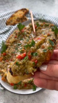 Kyopolou or Eggplant Caviar is a delicious garlicky roasted eggplant spread that is amazing on its own or to enjoy with some crusty breads. It’s a staple in Bulgarian Cuisine and something I have been enjoying all my life!  Ingredients:  2 medium sized eggplants  1 red bell pepper  3 garlic cloves  1 tbs parsley  1 tbs dill  2 tbs apple cider vinegar  3 tbs olive oil  1 tsp salt plus more for sprinkling on the eggplants   Method:  1. Preheat oven to 425 F; 2. Cut eggplant lengthwise, score and sprinkle salt generously and let it sit on paper towels to release its moisture;  3. Drizzle olive oil on both sides of eggplant and place face down on a baking sheet; add the pepper and roast for about 40 mins as you flip the pepper on all sides;  4. Let cool completely and peel eggplants and peel a