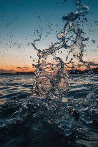 Water Splash on Body of Water during Sunset · Free Stock Photo