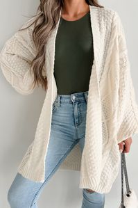 100% POLYESTER Model Wearing Size Small Color: Cream Cable Knit Cardigan Open Front Bubble Sleeves Mid-Thigh Length Material Has Stretch 19" Armpit To Sleeve End 25" Armpit To Hemline For Model Size Specs Please Check Size Charts Launched: 11/13/23