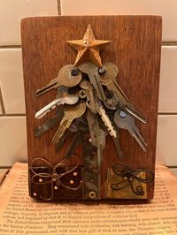 Found Object Art Piece Christmas Tree made by me on wood with vintage keys, a rusty star, and copper and brass presents. Comes ready to hang and it's signed by the artist (me).