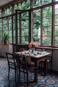 I love the windows and the greenery. I want this as a dining room.