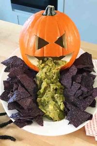 No party is complete without chips and dip. Guacamole — well, that's extra. To add spook to your snack table, add a Jack-o'-Lantern into the mix.