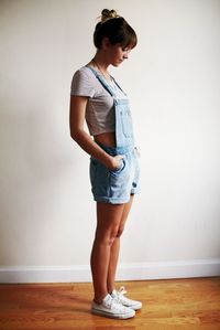 Overall shorts, simple cropped tee, up do, and high top white converse.