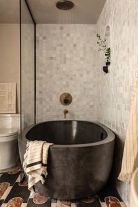 Native Trails' Avalon 62 concrete bathtub in Slate. Design by Aker Interiors.