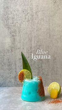 - Blue Iguana -  Saw this drink on @drinkaholics Instagram and got super inspired (thanks guys!). I have to say this is probably one of my favorite drinks EVER.  Wow. The original recipe calls for mango juice, but I’m not a big mango fan so I used peach juice instead. If you like tropical drinks this is right up your alley 🔥  🦎💙 To make, add the following to a cocktail shaker:  • - Ice   • - 2oz tequila  • - 2oz peach juice (I used the one from Trader Joe’s)  • - The juice of 1/2 a lime  • - 1 oz blue curaçao   - Drizzle (sweetened) condensed milk  Shake and pour into a tajin rimmed glass.  The color is literally beautiful and the flavor is insane. You have to try it.