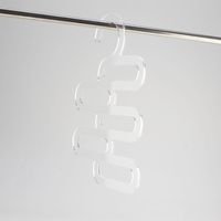 Acrylic hanger for holding multiple belts, integrated hook for use in wardrobes.