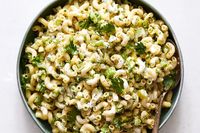 NYT Cooking: Consider this a macaroni salad for the 21st century: Like the original, it’s a welcome accompaniment to picnic fare and pairs with virtually anything off the grill. But this version also happens to be bright, acidic and herbaceous. The traditional elements have been preserved — elbow macaroni, mayonnaise and a pinch of sugar are mandatory — but they’ve been bolstered by bright flavors: lemon zest,