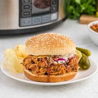 A real crowd-pleaser, shredded crockpot BBQ chicken is irresistible and super easy to make with 3 ingredients. Pile it on a bun or in a soft tortilla, add it to a salad or bowl, or fill a baked sweet potato.