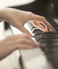 Playing a beautiful melody on the piano.