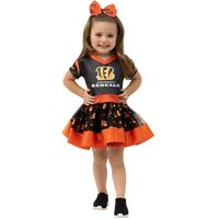 Bring the spirit of the Cincinnati Bengals to Halloween or dress-up with this Tailgate Game Day costume. The top part features sparkly Cincinnati Bengals graphics and a V-neck that emulates jerseys, and the adorable tutu is adorned with a team-inspired, shiny metallic design all over. Plus, polyester material creates a soft feel for hours of comfortable wearing. Set includes dress and bow Imported Officially licensed Surface washable Material: 100% Polyester Brand: Jerry Leigh V-neck Sublimated