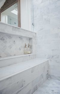 Oversized shower niche with arabesque carrara marble in French elegant master bathroom