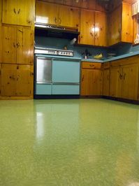 Retro Kitchen, Green Floor, Pine Cabinets.