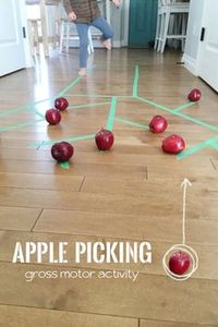 Apple tree picking activity that's great for gross motor skills