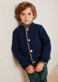 This Classic Blue Austrian Wool Jacket is fully lined and designed to keep your little one warm and cosy during the cooler months. A traditional silhouette, the bold blue jacket features a contrasting beige trim and detailed metal stamp buttons for its single-breasted fastening down the front. It includes two symmetrical functioning pockets with a contrasting trim on the front. 100% Wool Machine Washable on a delicate/cool setting up to 30 degrees or dry clean Garment fit is true to size Made in