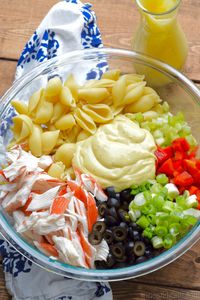 This Crab Pasta Salad is a family recipe, one of my favorites! Packed with veggies and delicious flavor, it's a staple at summer BBQs!