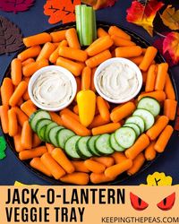 This super easy and festive Jack-O-Lantern Veggie Tray is a healthy Halloween party platter that’s fun to make with the kids!