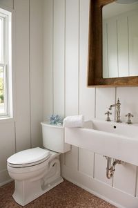 Cottage Powder Room with Vertical Shiplap Walls - Cottage - Bathroom