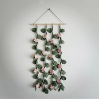 Handmade Crochet Vine and Flower Wall Hanging A cute accessory to add some life to any room. They are 12 in (30.5cm) wide.  Each vine is approximately 22 in (56 cm) long. From top to bottom hanging (total length) it will be approximately 27 in (68.5 cm). Local pickup is available in Red Deer, AB / Lacombe, AB.  Use the code LOCAL and please contact me to arrange a pickup time and location.   https://trinketsbykortney.etsy.com?coupon=LOCAL 🌿 All items are designed and handmade by TrinketsByKortn